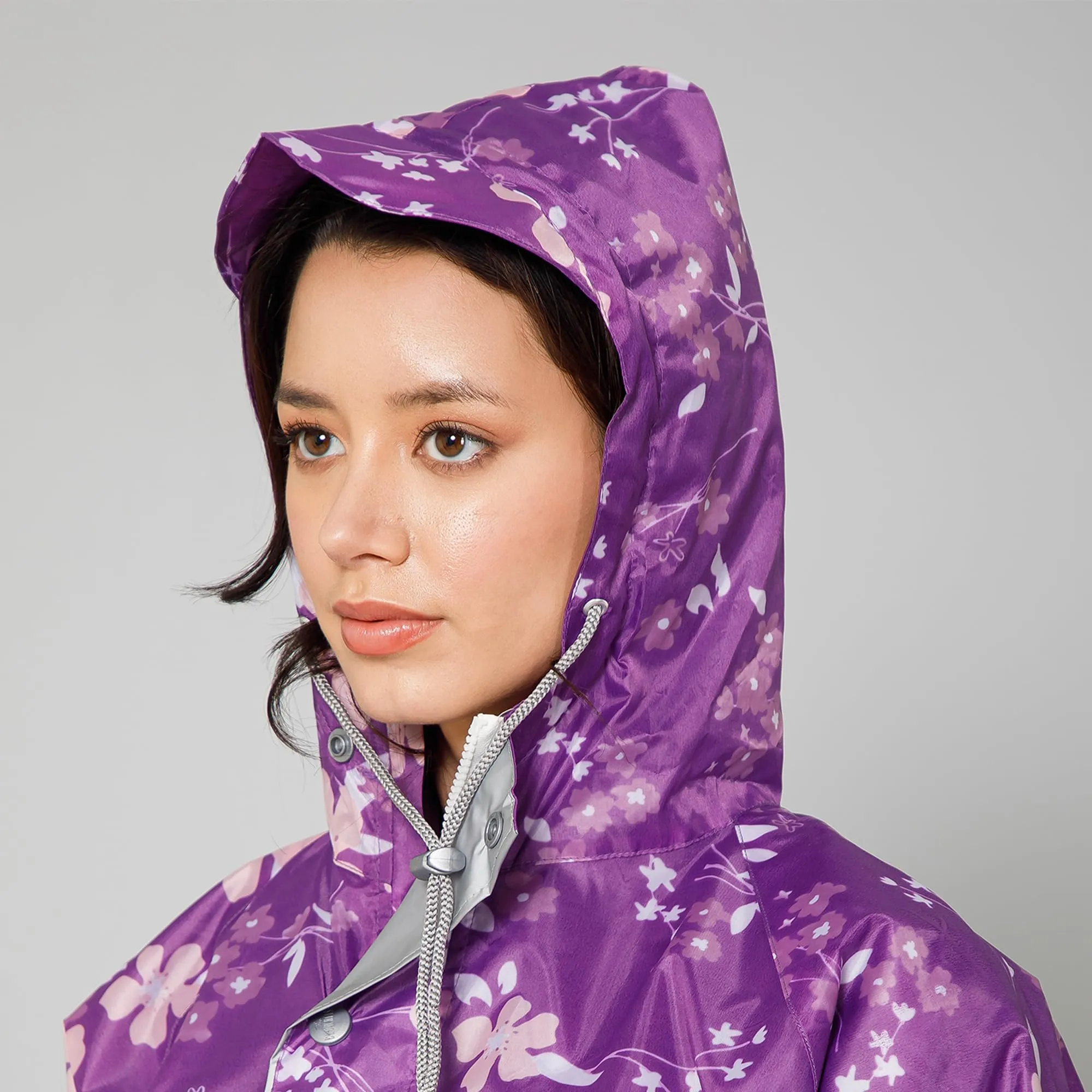 THE CLOWNFISH Polyester Waterproof Rain Coat For Women Skirt and Top Raincoat With Adjustable Hood and Front Pockets Rain Glam Series (Purple Floral, XX-Large)