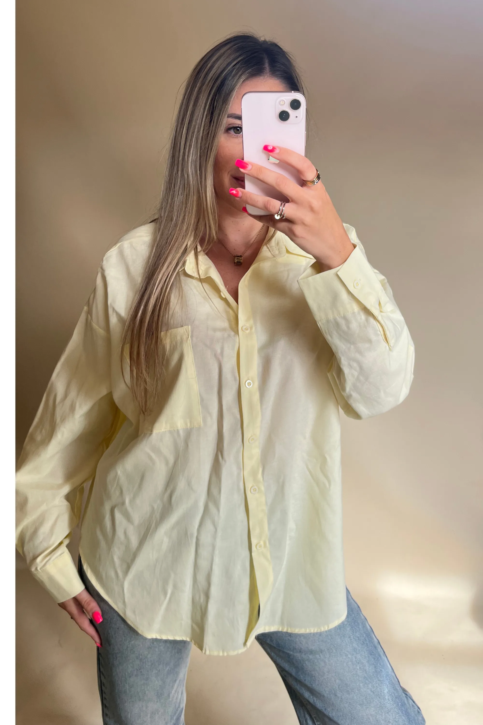 Yellow long sleeved button up shirt